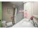 Bathroom with walk-in shower featuring tiled walls and modern fixtures and marble countertop at 614 N Waterway, Venice, FL 34285
