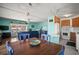 Bright, open-concept space featuring a living room, dining area, and kitchen with modern appliances at 614 N Waterway, Venice, FL 34285