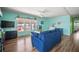 Comfortable living room featuring stylish decor, a modern entertainment system, and an aquarium at 614 N Waterway, Venice, FL 34285