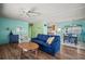Cozy living room flows into dining area and features comfortable seating and bright, colorful decor at 614 N Waterway, Venice, FL 34285