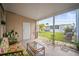 Outdoor patio features stone flooring, seating, and views of the manicured lawn at 614 N Waterway, Venice, FL 34285