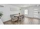 Stylish dining area with modern table, seating, and minimalistic decor at 616 S Casey Key Rd, Nokomis, FL 34275
