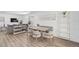 Contemporary dining area featuring a wooden table and modern seating at 616 S Casey Key Rd, Nokomis, FL 34275