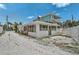 Exterior view of the home showing the upstairs and the parking area at 616 S Casey Key Rd, Nokomis, FL 34275