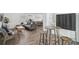 Inviting living area with a modern sofa, bar table, and stylish decor at 616 S Casey Key Rd, Nokomis, FL 34275