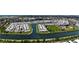 Panoramic aerial view showcasing the community's waterfront location and recreational facilities, like a baseball field at 623 Leisure, Venice, FL 34285