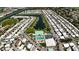 Aerial shot of a charming community with a pool, tennis courts, baseball field, and boat docks at 623 Leisure, Venice, FL 34285