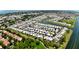 Expansive aerial perspective of the community with waterfront access, lush landscaping, and nearby amenities at 623 Leisure, Venice, FL 34285