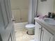 Bathroom featuring a toilet, sink, vanity, and shower with curtain at 623 Leisure, Venice, FL 34285
