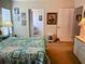 Bright bedroom featuring a comfortable bed, a side table, and decorations on the walls at 623 Leisure, Venice, FL 34285