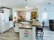 Bright kitchen offers a breakfast bar and easy access to the screened porch and living room at 623 Leisure, Venice, FL 34285