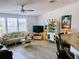 Comfortable living room features stylish furnishings, lots of natural light, and sleek flooring at 623 Leisure, Venice, FL 34285