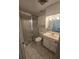 Bathroom with a shower behind sliding glass doors, a toilet, and a sink with a large mirror at 624 White Pine Tree Rd # 5, Venice, FL 34285