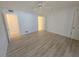 Spacious bedroom with wood flooring, ceiling fan, and neutral paint, creating a serene atmosphere at 624 White Pine Tree Rd # 5, Venice, FL 34285