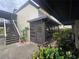 Charming condo exterior with a lovely screened in porch and mature landscaping around the property at 624 White Pine Tree Rd # 5, Venice, FL 34285