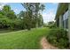 Spacious backyard featuring lush greenery and a well-maintained lawn at 6619 Pinefeather Ct, Bradenton, FL 34203