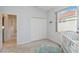 Serene bedroom with a window view, closet, and calming colors, perfect for relaxation and restful sleep at 6619 Pinefeather Ct, Bradenton, FL 34203