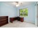 Bedroom with large desk, chair, and bookshelf at 6619 Pinefeather Ct, Bradenton, FL 34203