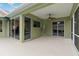 Spacious lanai featuring a fan and large windows for natural light and indoor/outdoor living at 6619 Pinefeather Ct, Bradenton, FL 34203