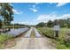 Picturesque pond and walking bridge offering a tranquil outdoor experience at 6619 Pinefeather Ct, Bradenton, FL 34203