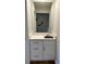 Bathroom with a mirror and vanity featuring a sink at 7201 Daiquiri Ln, Tampa, FL 33634