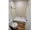 Clean bathroom featuring a shower/tub combo and efficient toilet at 7201 Daiquiri Ln, Tampa, FL 33634