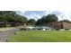 Community pool view with a well-maintained lawn at 7201 Daiquiri Ln, Tampa, FL 33634