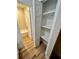 Hallway featuring built in closet and access to the bathroom at 7201 Daiquiri Ln, Tampa, FL 33634
