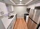 Efficient kitchen featuring stainless steel appliances, sleek countertops, and modern cabinetry at 7201 Daiquiri Ln, Tampa, FL 33634