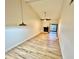 Open-concept living room with lots of natural light, wood floors, and a fireplace at 7201 Daiquiri Ln, Tampa, FL 33634