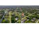 Aerial view of home showcases the neighborhood, landscaping, and proximity to water and amenities at 7257 Maguire Ln, Englewood, FL 34224
