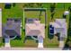 Aerial view of the property highlights the backyard, landscaping, and neighboring homes in the community at 7257 Maguire Ln, Englewood, FL 34224