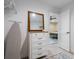 Organized closet and dresser leading to a bedroom at 7257 Maguire Ln, Englewood, FL 34224