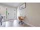 Welcoming entryway featuring a bright white door, side windows, and a charming workstation at 7257 Maguire Ln, Englewood, FL 34224