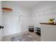 Spacious walk-in closet with ample shelving, a colorful rug, and efficient storage solutions at 7257 Maguire Ln, Englewood, FL 34224