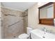 Accessible bathroom features a tiled walk-in shower with grab bar, modern vanity, and neutral color palette at 756 White Pine Tree Rd # 204, Venice, FL 34285