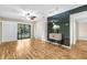 Bright and open living room with sliding door to balcony and contemporary ceiling fan and lighting at 756 White Pine Tree Rd # 204, Venice, FL 34285