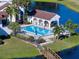 Overhead view of the community pool with sun loungers and clear blue water at 800 Capri Isles Blvd # 235, Venice, FL 34292