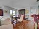 View of dining area with wood floors, table and chairs and china cabinet at 800 Capri Isles Blvd # 235, Venice, FL 34292