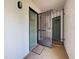 Front entrance with security gate and dual doors, each with unique decorative windows at 800 Capri Isles Blvd # 235, Venice, FL 34292
