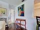 Bright entryway with hardwood floors, white walls, and decor in a home at 800 Capri Isles Blvd # 235, Venice, FL 34292