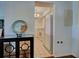 Entryway leading to kitchen, featuring a white refrigerator and tile flooring at 800 Capri Isles Blvd # 235, Venice, FL 34292