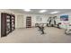 Well-equipped fitness center featuring exercise machines, weights, and a cozy reading nook at 800 Capri Isles Blvd # 235, Venice, FL 34292