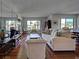 The bright and airy living room has hardwood floors and lots of natural light at 800 Capri Isles Blvd # 235, Venice, FL 34292