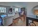 Open-concept living room and dining area with hardwood floors and ample natural light at 800 Capri Isles Blvd # 235, Venice, FL 34292