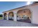 Community pavilion offering a shaded lounge area with seating, a grill, and elegant architectural details at 800 Capri Isles Blvd # 235, Venice, FL 34292