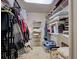 Walk-in closet with built-in shelving, hanging racks, and ample storage space at 800 Capri Isles Blvd # 235, Venice, FL 34292