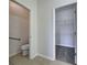 Bathroom with separate toilet room and walk-in closet at 9157 Genesee St, Port Charlotte, FL 33981