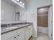 Bathroom with double vanity sink and view to the shower at 9157 Genesee St, Port Charlotte, FL 33981