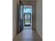 Bright entryway with tile floors and a view through a screened doorway to the outdoors at 9157 Genesee St, Port Charlotte, FL 33981